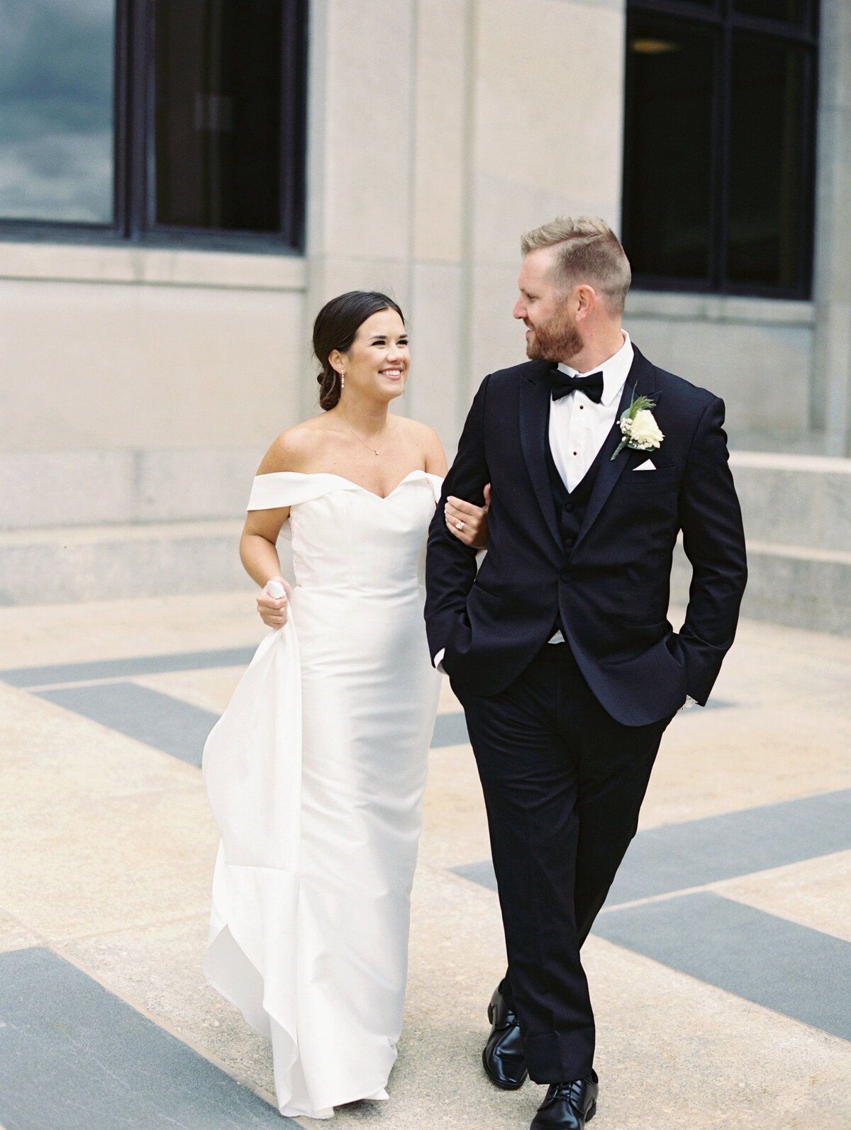 Bride and groom walking and smiling to show chicago wedding photos by Allison Francois Photography