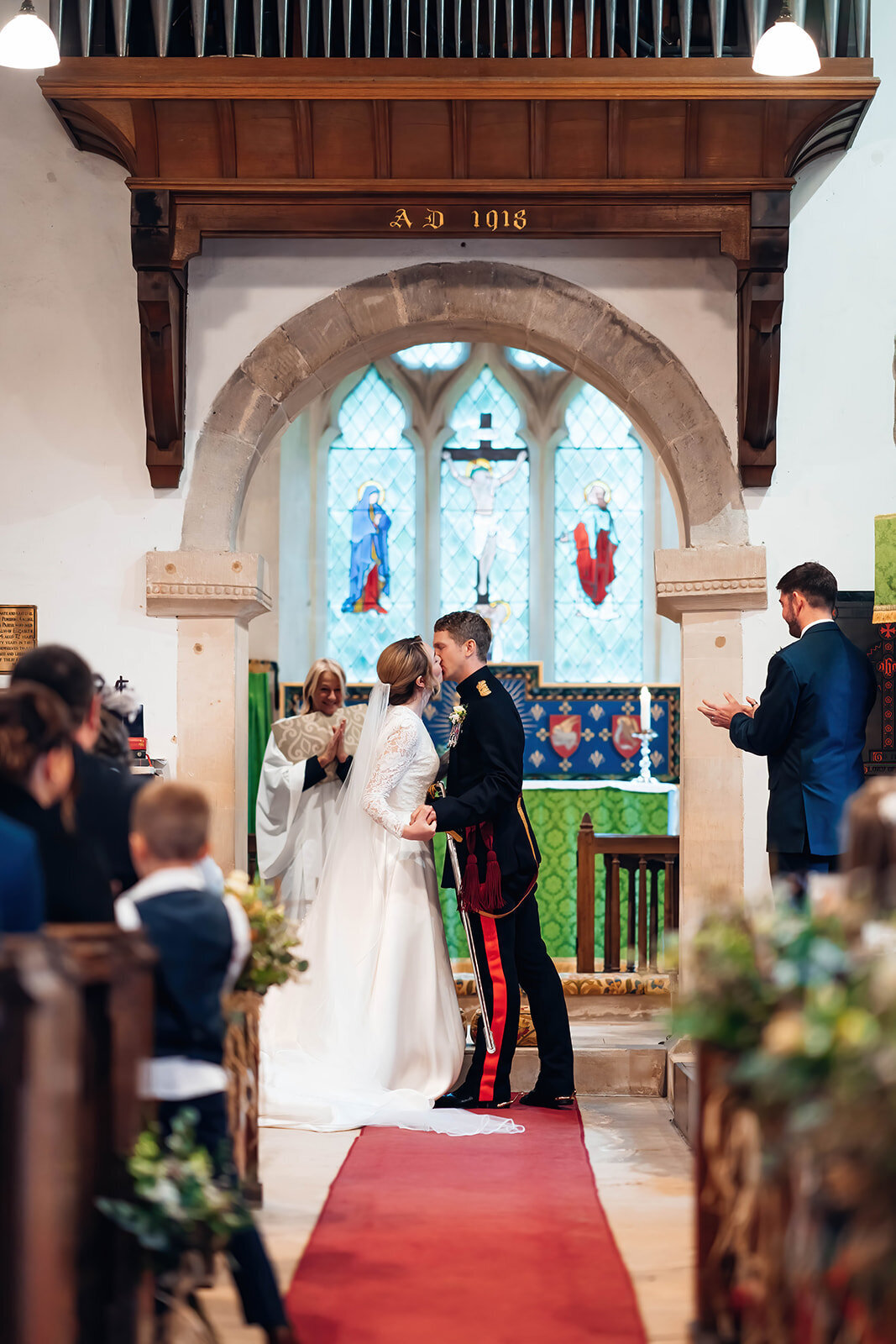 cotswold-church-wedding-first kiss