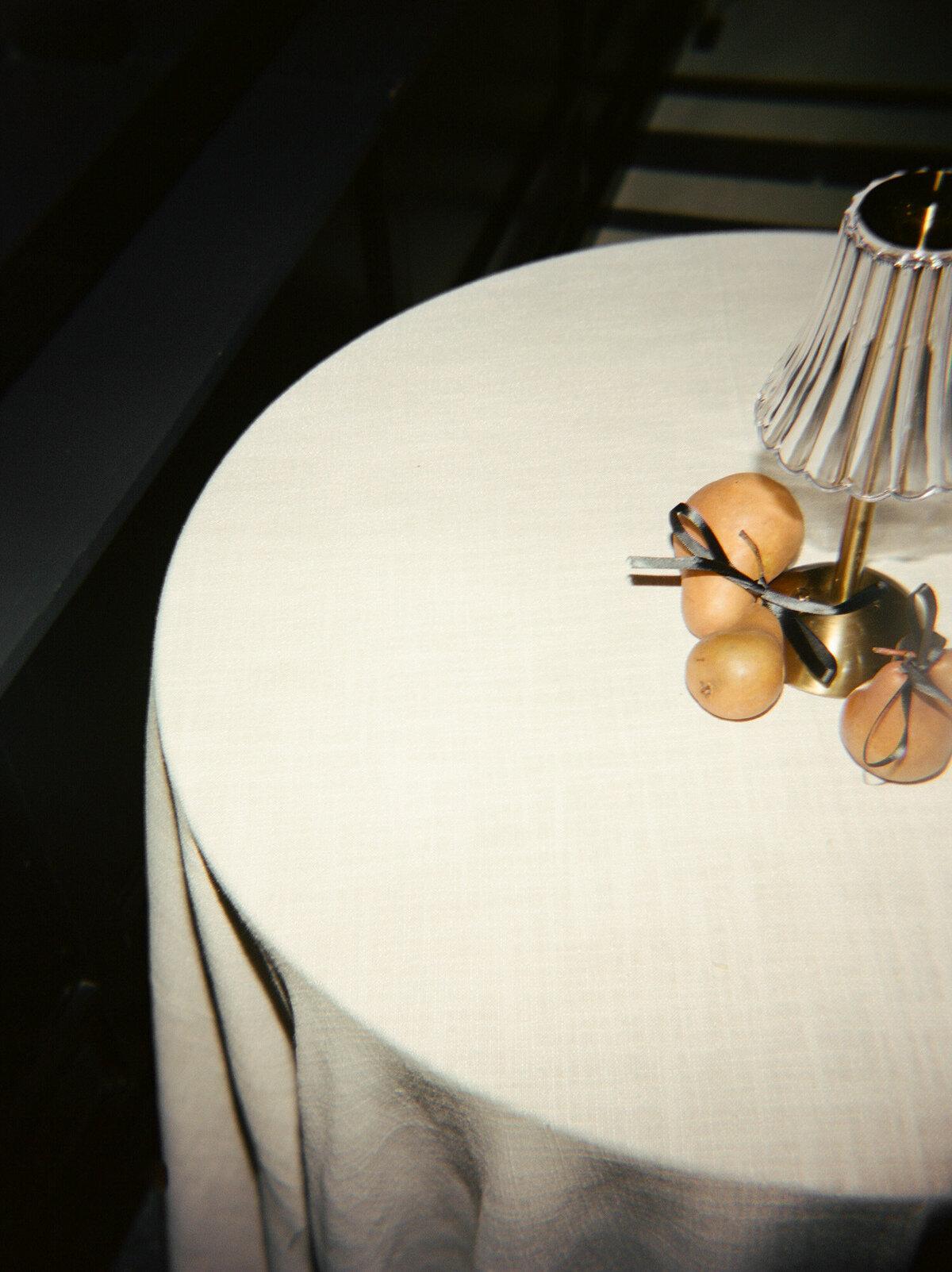 artistic film wedding photography of fall wedding details at Shinola Hotel, pears with ribbons