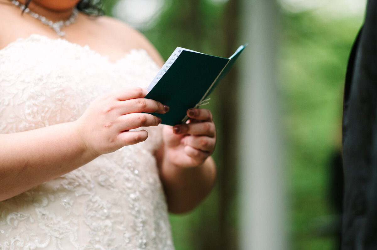 Close up of teal wedding vow book