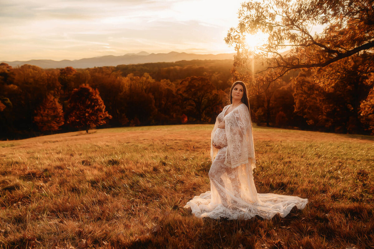 Pregnant woman poses for Maternity Session at Biltmore Estate in Asheville, NC.