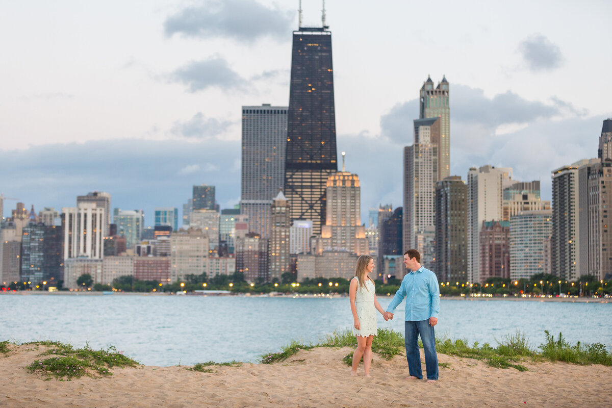 A summer engagement session on the beach in front of the Chicago skyline.