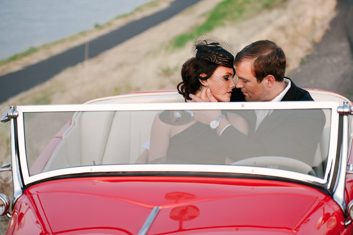 vogue engagement photo with vintage red convertible in portland oregon