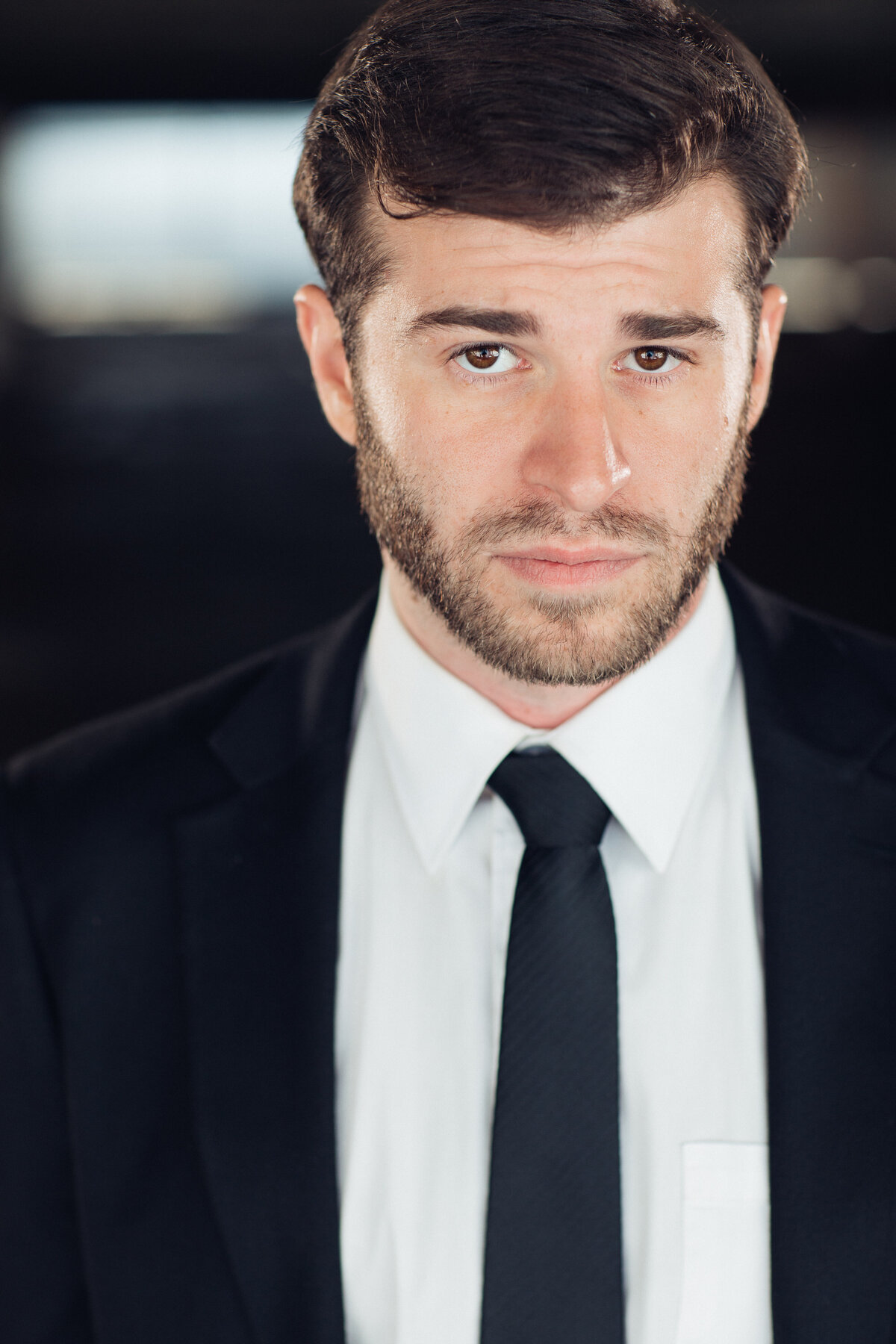 Young Man Wearing Black Suit with Black Necktie Headshot in LA