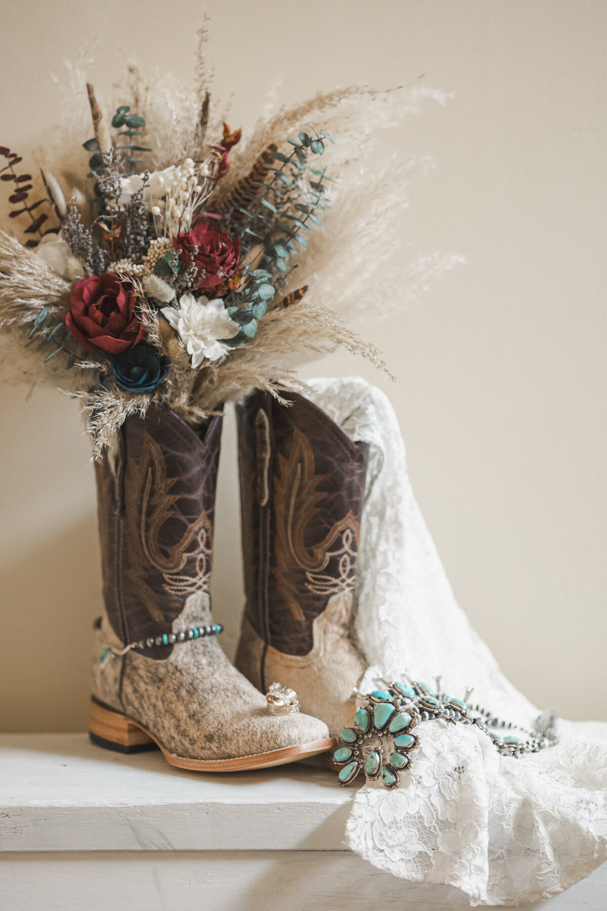 Wedding detail photos. Cowboy boots. Turquoise wedding jewelry. Midwest Wedding Photography. Nebraska Wedding Photography.