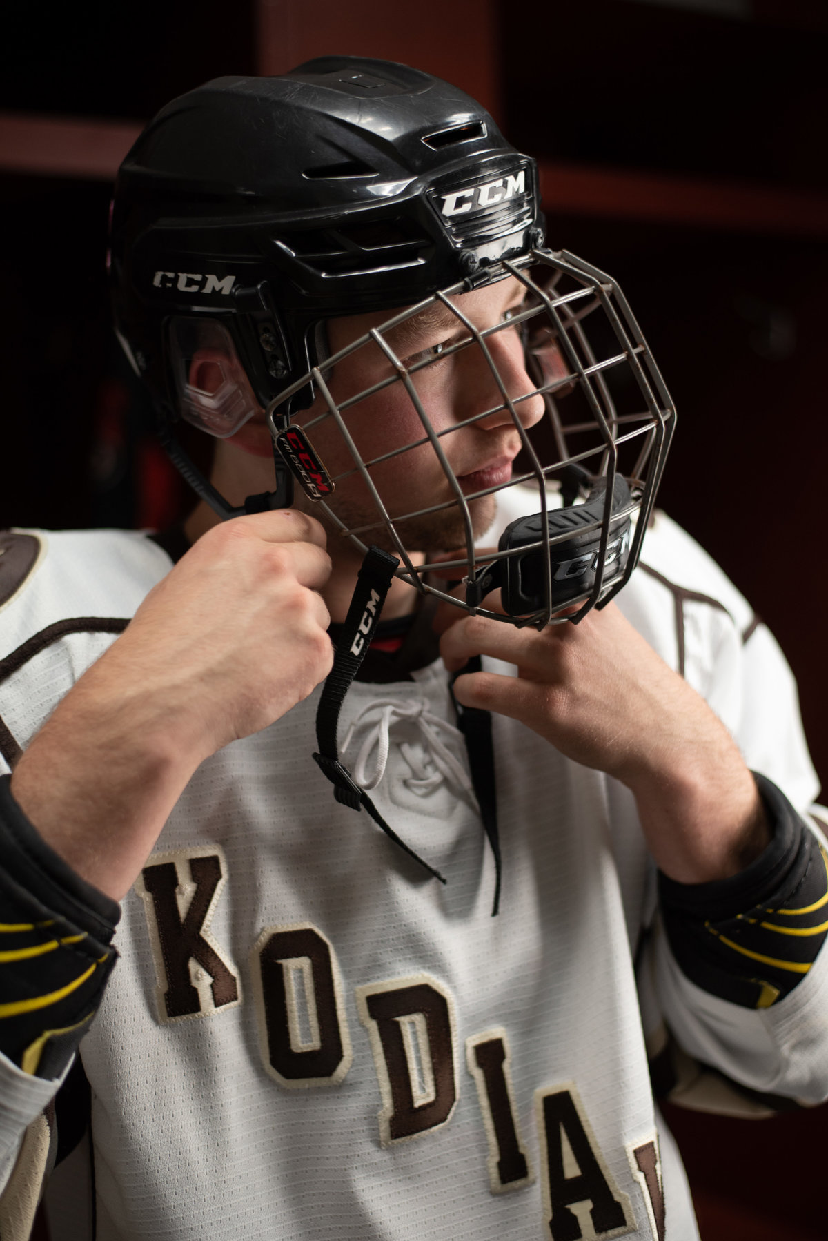 Senior guy in hockey jersey and face mask