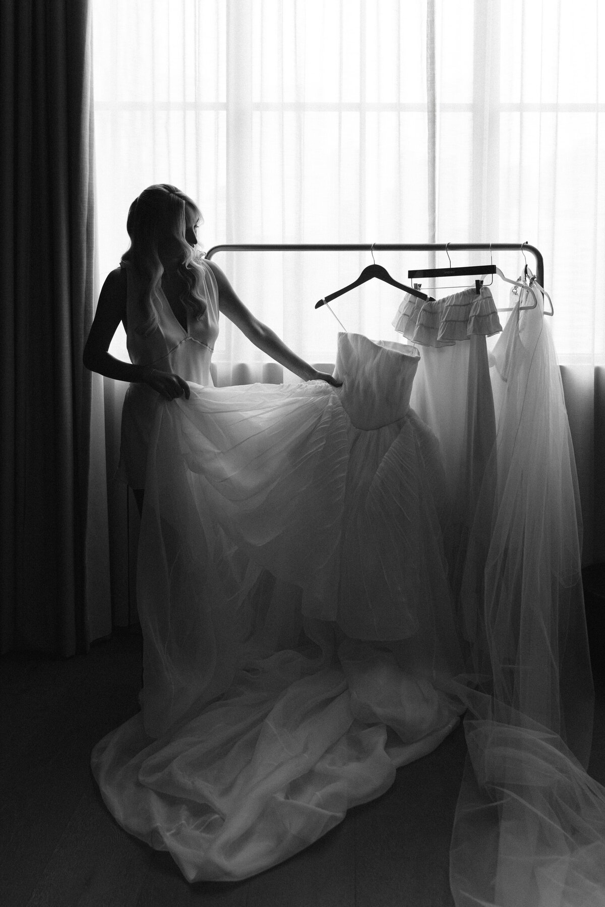 Sophisticated editorial wedding photography captures luxury bridal preparation at NOBU Hotel Chicago, featuring fashion forward styling and Lauren Alatriste's magazine-worthy approach combining editorial excellence with authentic wedding day emotion.