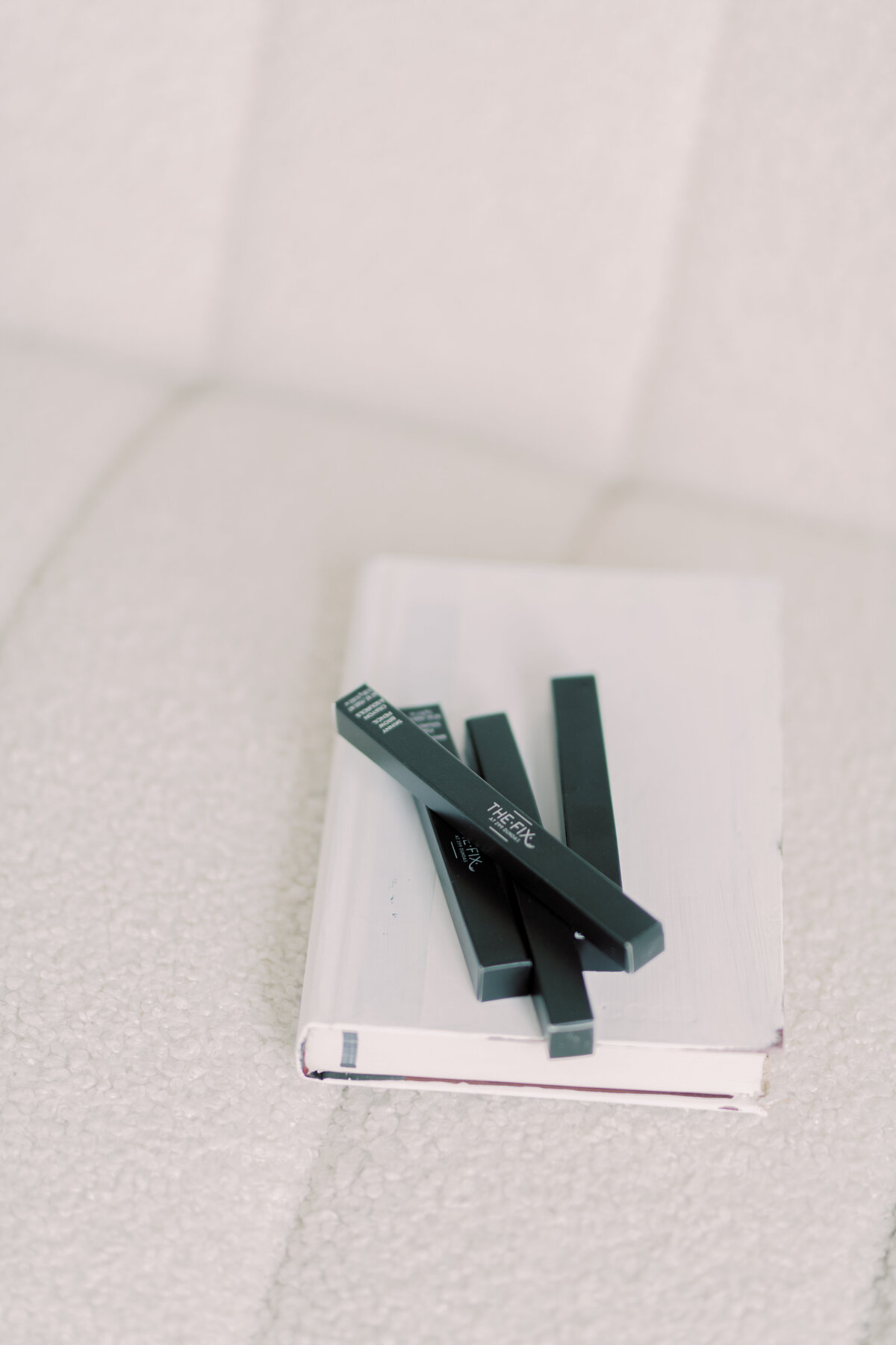 Makeup that her business has to offer styled on a book
