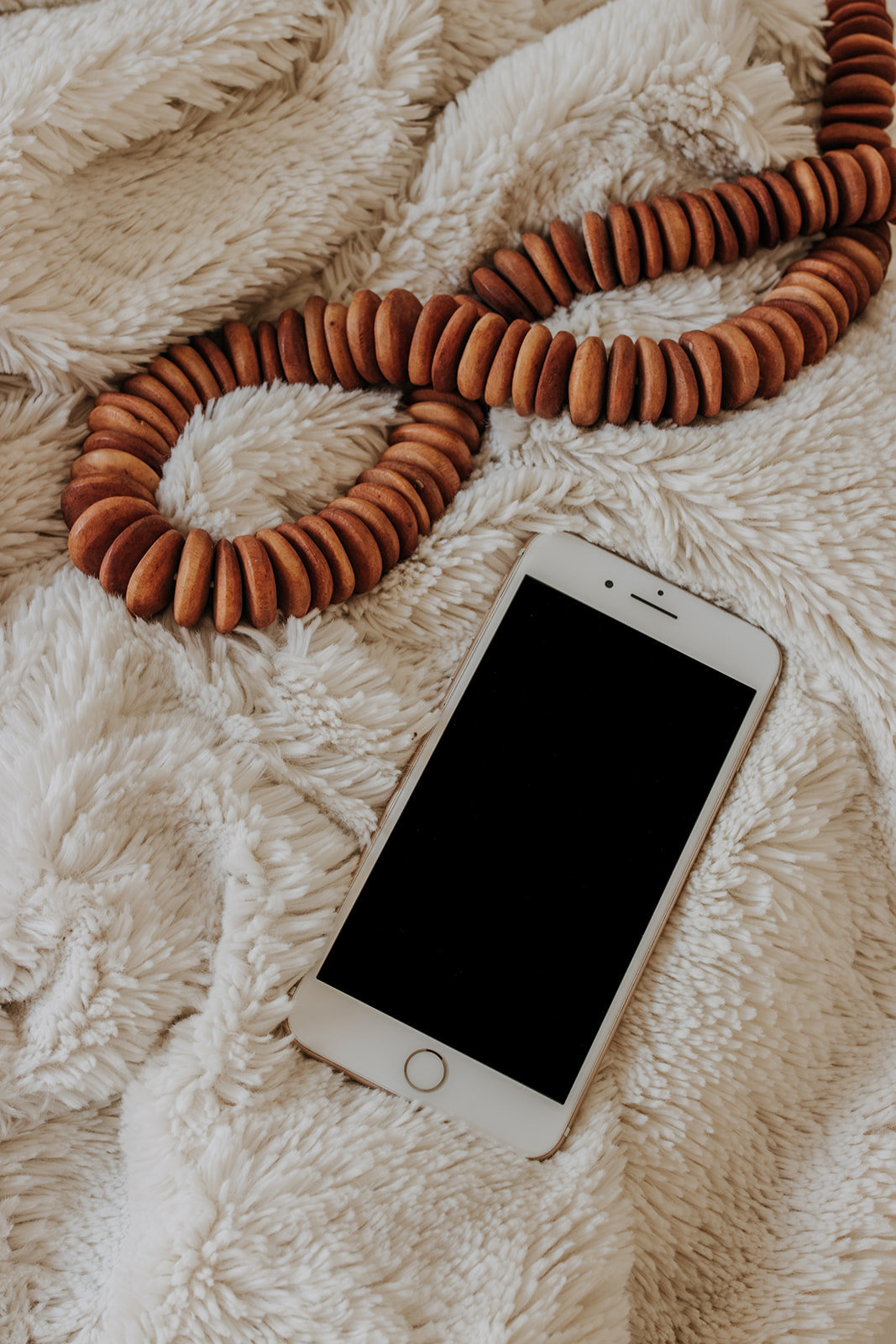 iphone on cozy blanket