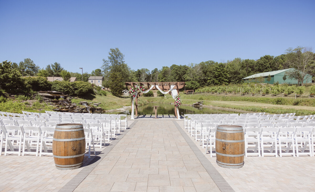 outdoor wedding ceremony with hot pink elegant theme at bear brook valley NJ photo