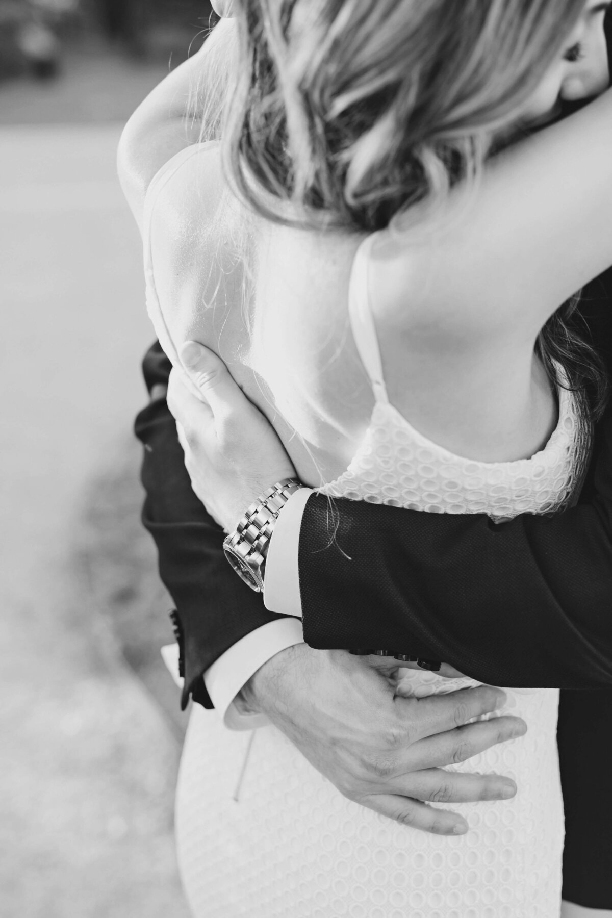 Black and white closeup of a couple embracing