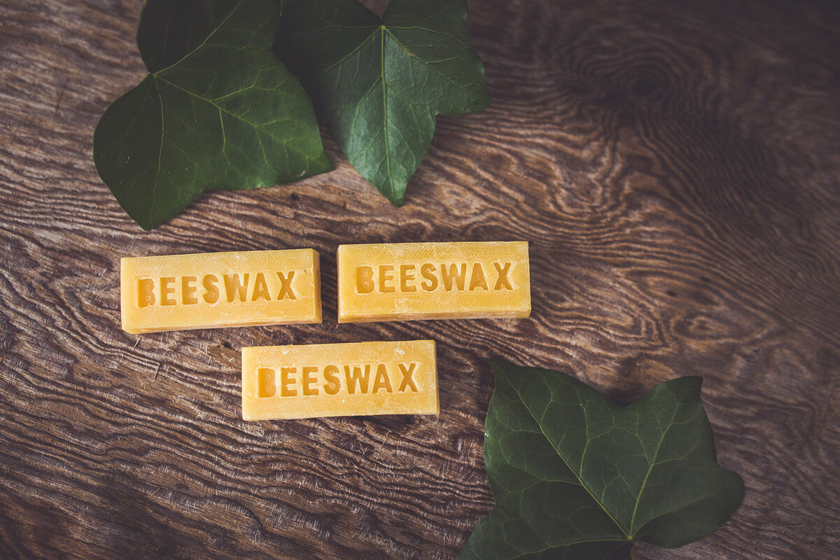 Photos of beeswax with leaves.