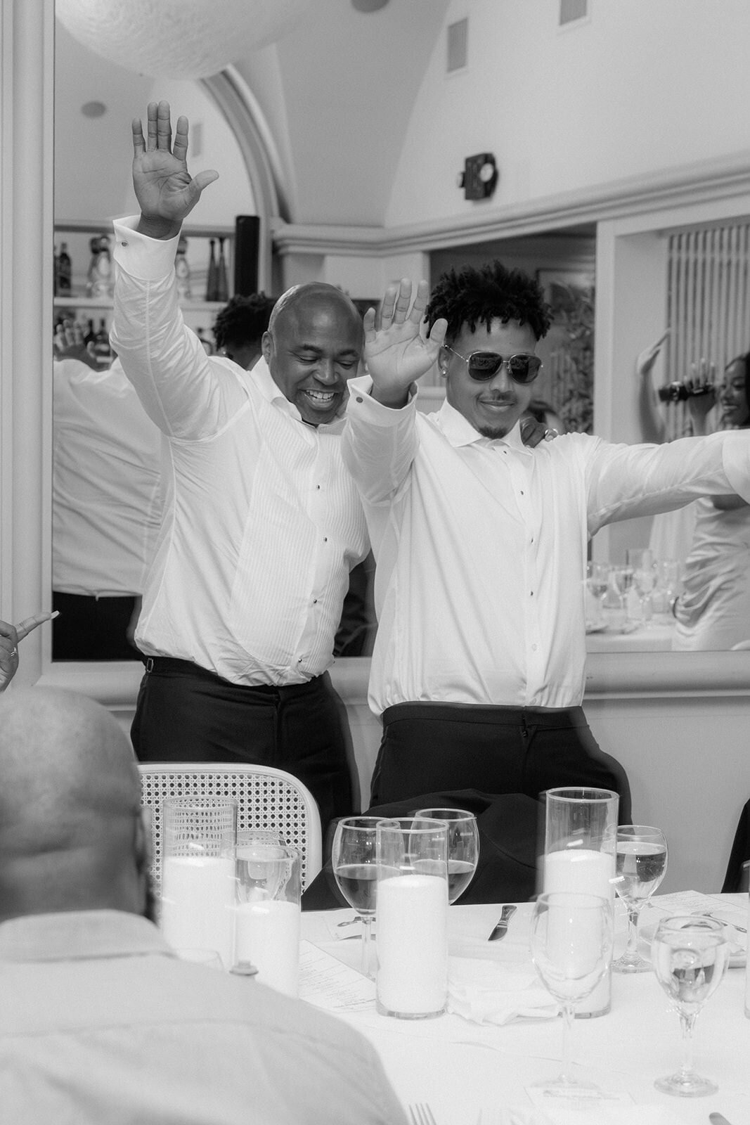 Two male guests celebrate the wedding at Greystone Mansion, Los Angeles.