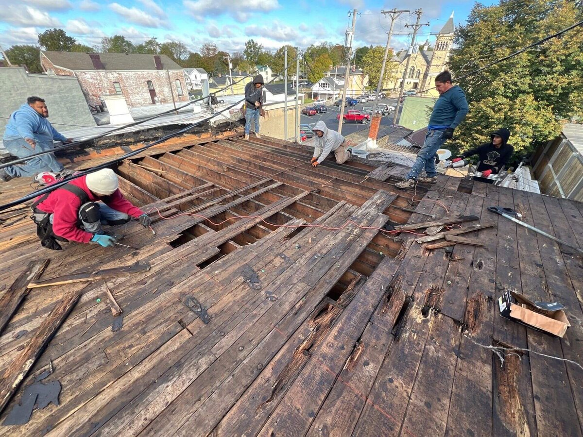 Black Bear Roofing team removing old roofing materials to start a roof replacement.
