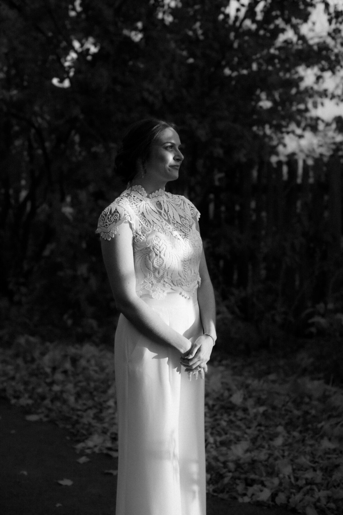 black and white portrait of a bride lit with light and shadows
