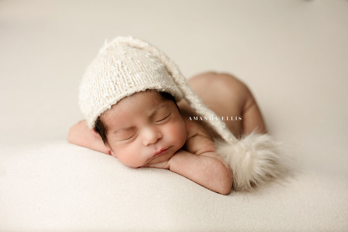 Bright-airy-newborn-portrait-of-baby-with-sleep-hat