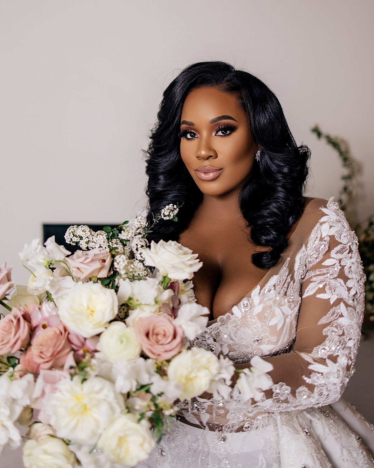 A black bride poses with a bouquet in Baltimore, MD.