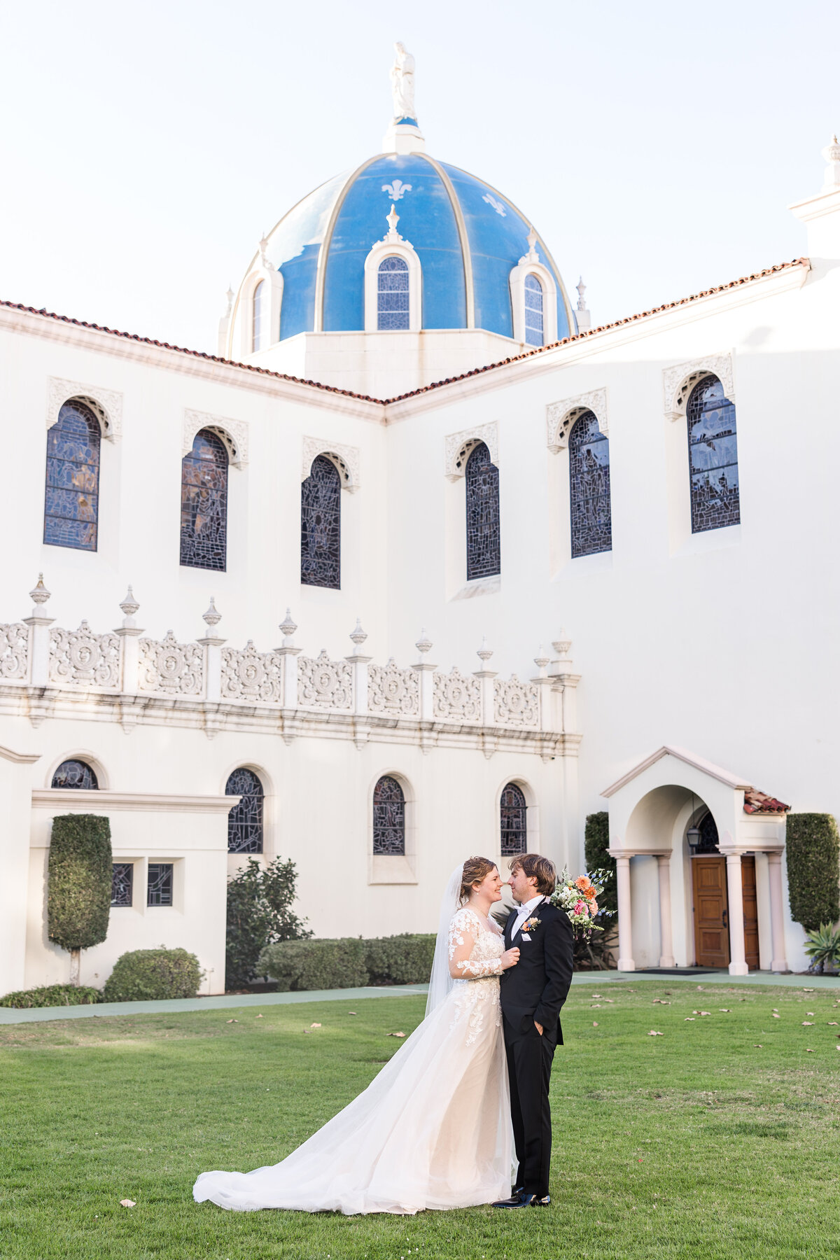 bride-and-groom-in-front-of-the-immaculata-san-diego