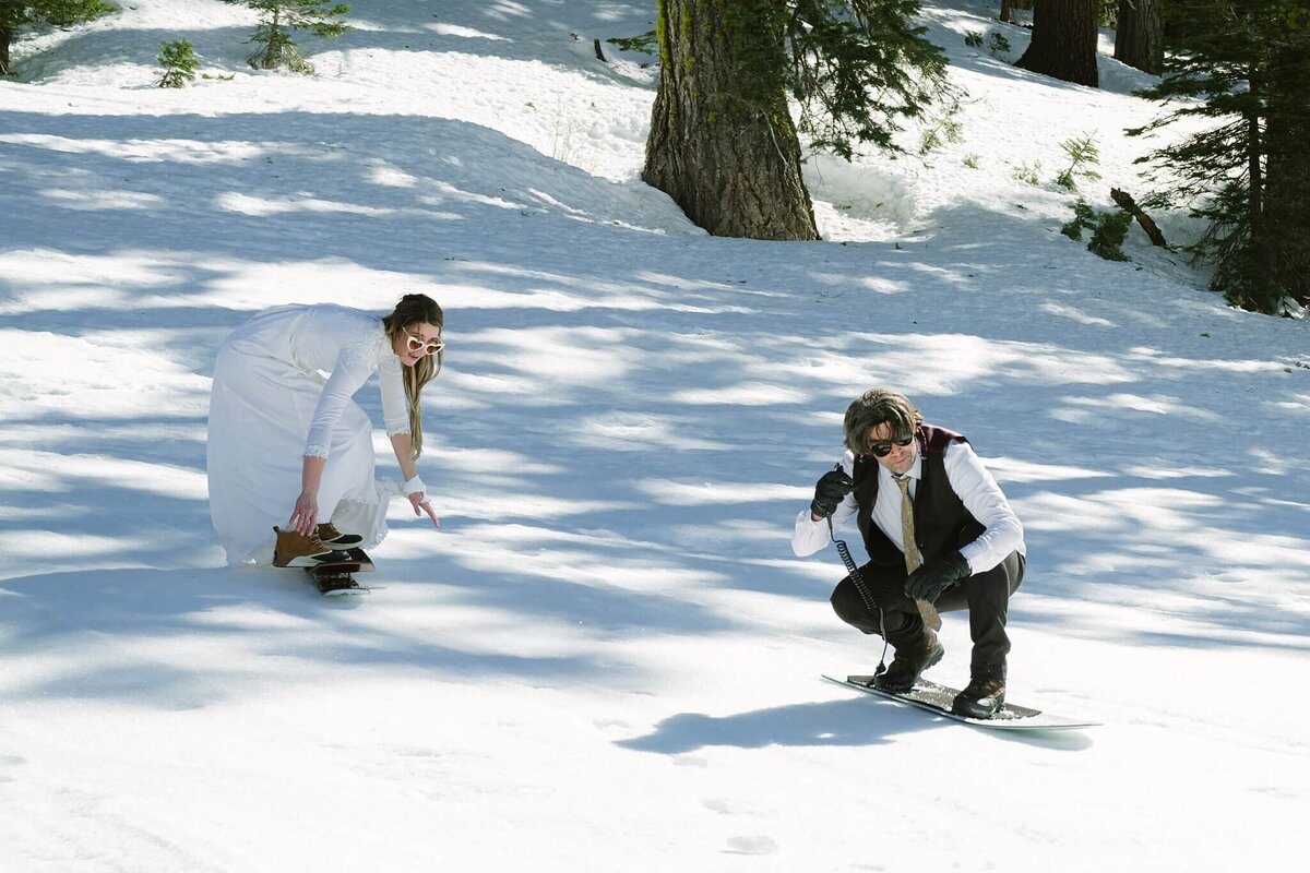 Bride and groom on snowskates after eloping in Tahoe