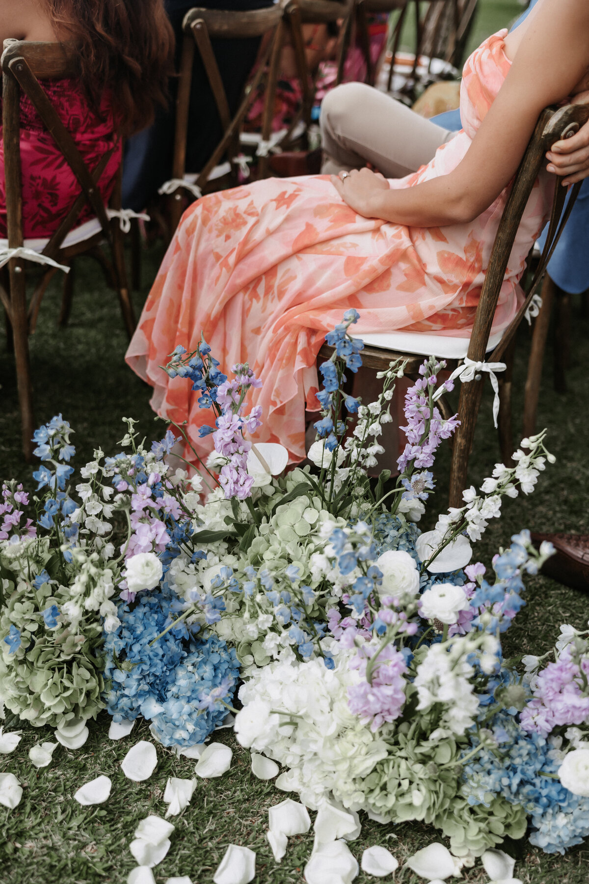 Ceremony aisle flowers and guests seated