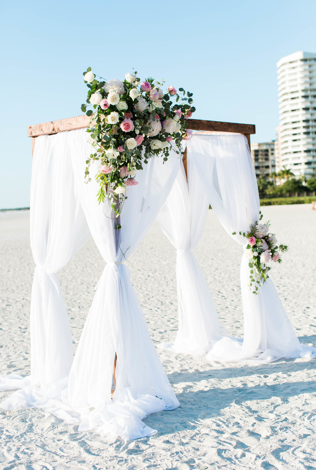 beach wedding ceremony floral arch