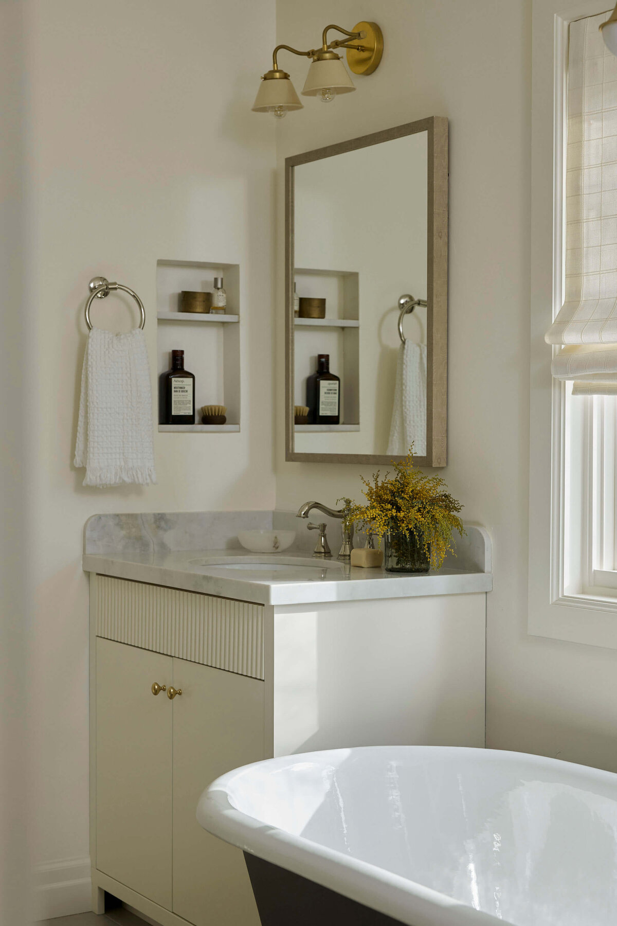 modern-bathroom-vanity-marble-countertop-brass-lighting