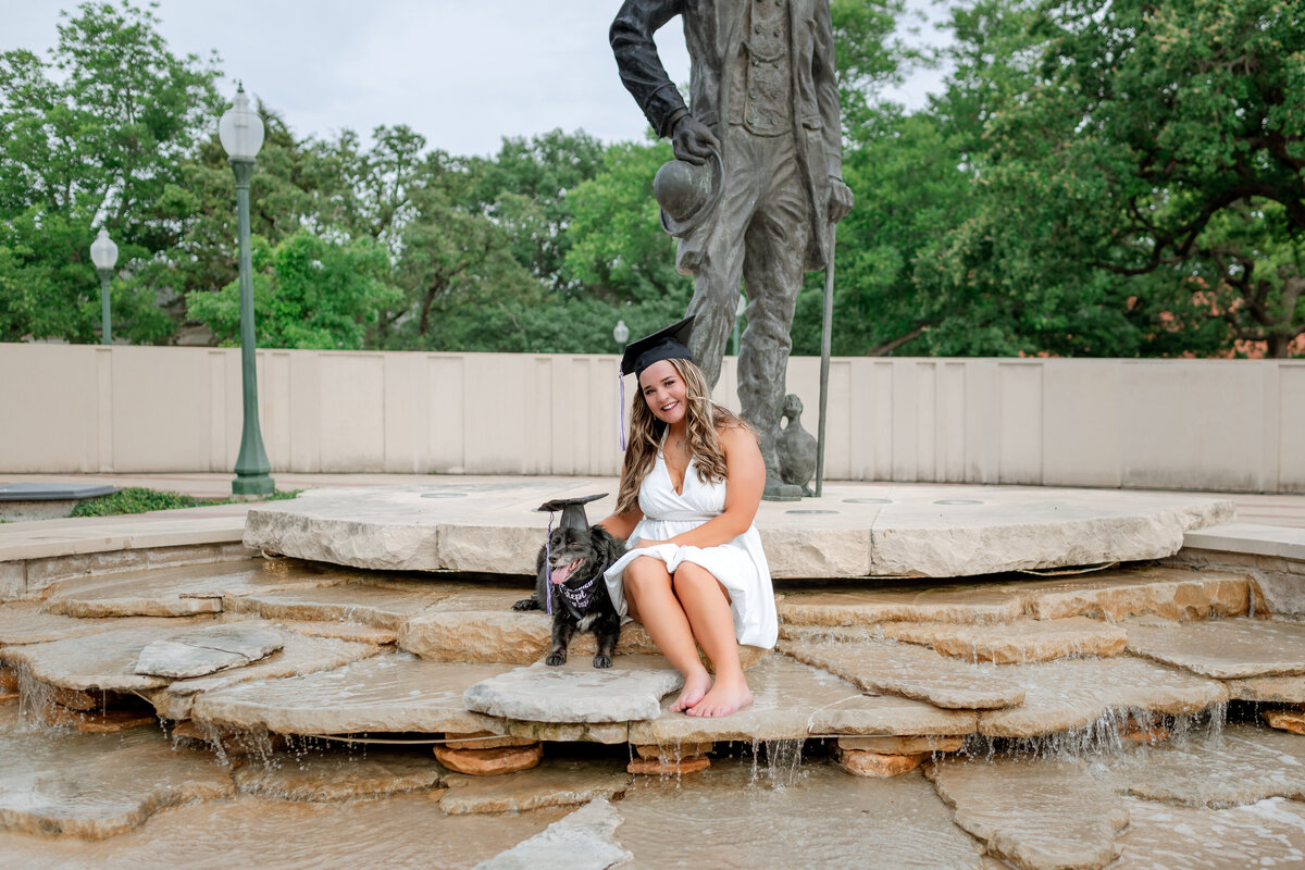 College Senior with her dog on campus during her senior photo session. 