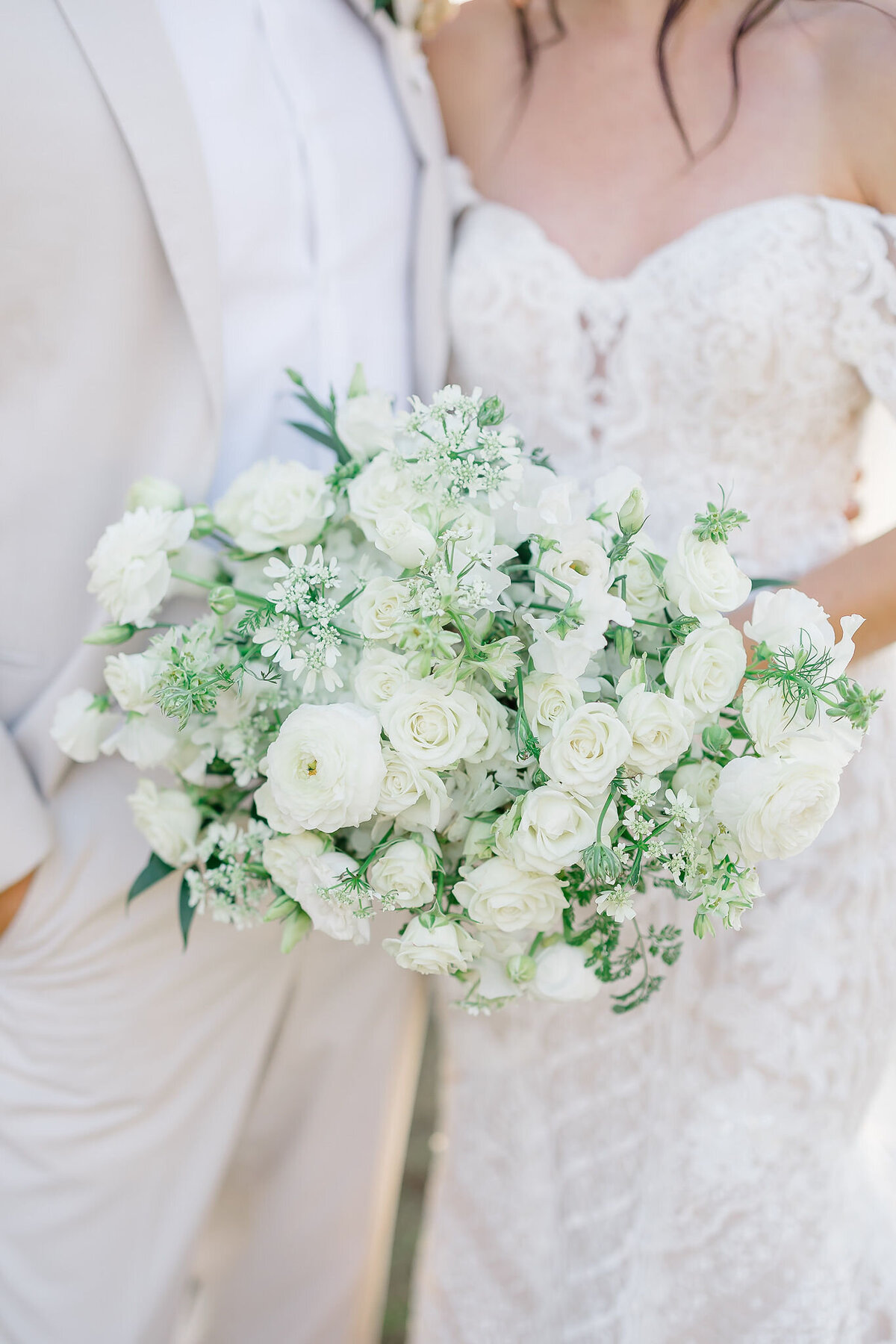 A classic bridal bouquet of white peonies, exuding elegance and sophistication.