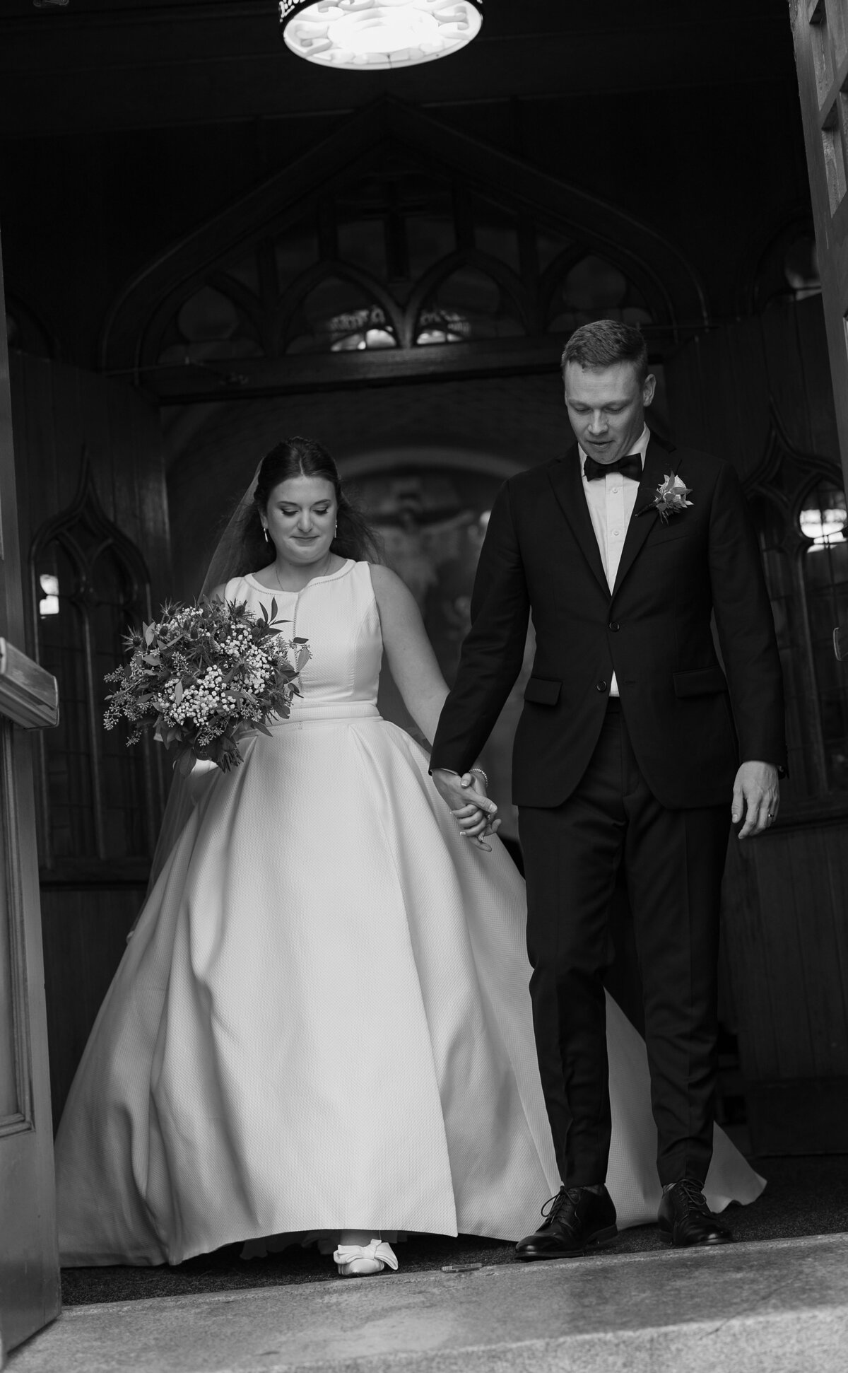 Bride and Groom exit the church after their Boston wedding ceremony.