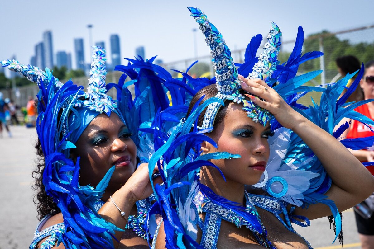 Toronto caribbean carnival parade masquerader in costume with Sunlime Mas, the number 1 medium size band at Toronto Carnival.