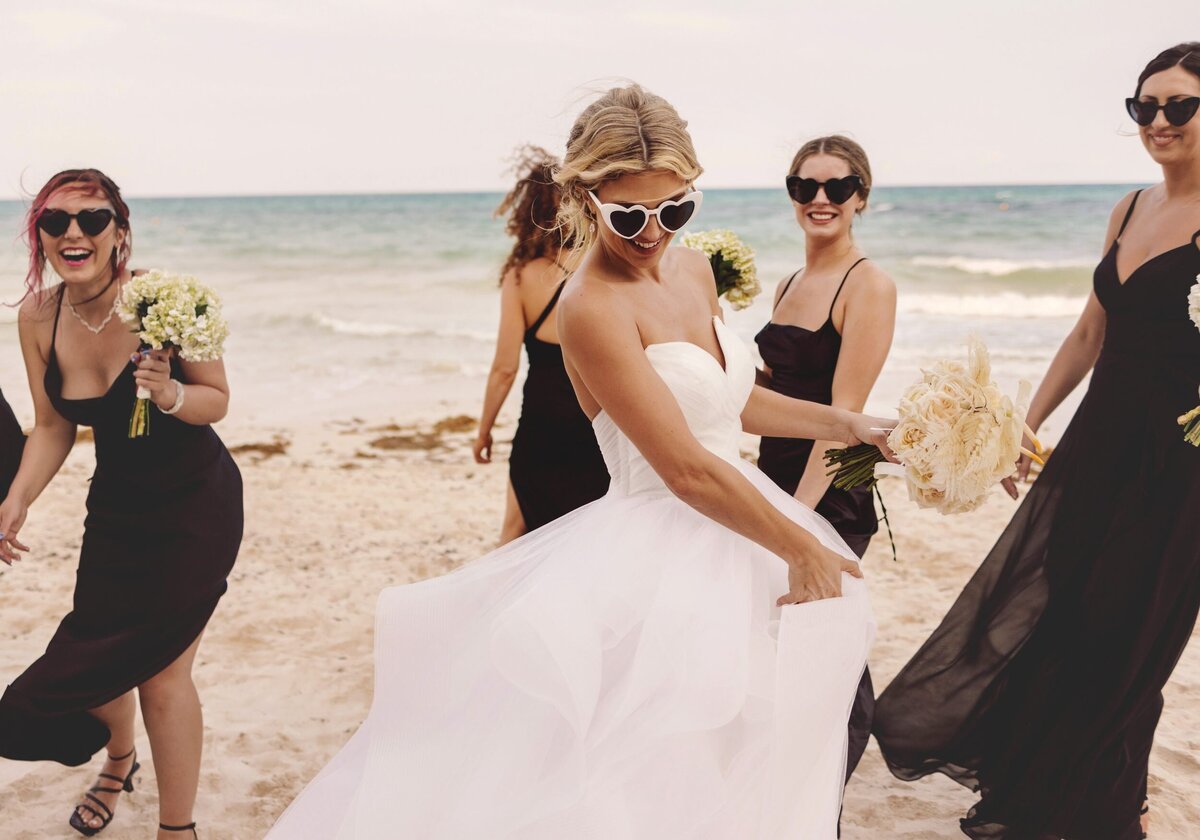 Bride and bridesmaids laughing at wedding in Riviera Maya
