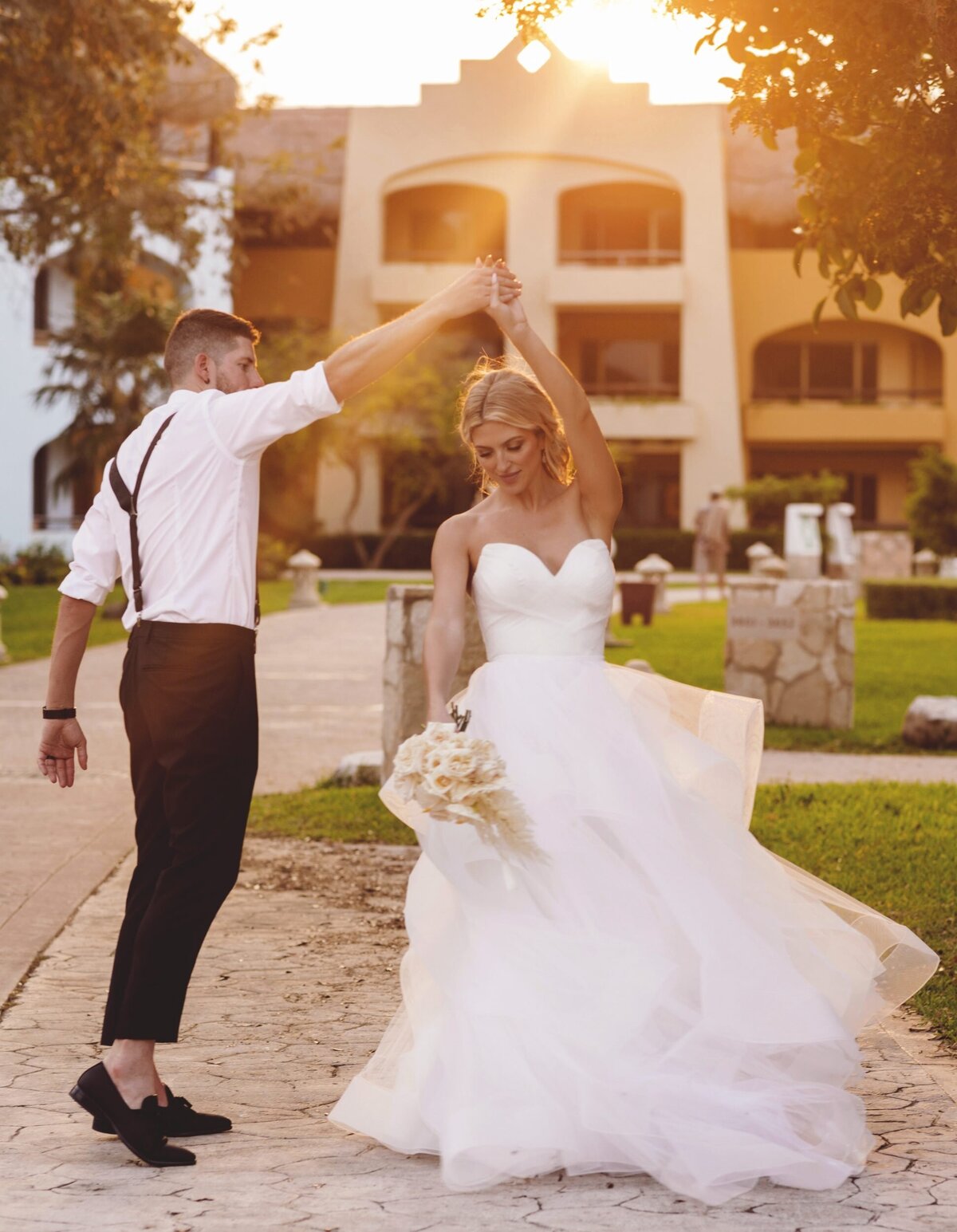Bride and groom dancing in the gardensat  Iberostar Paraiso Riviera Maya Wedding
