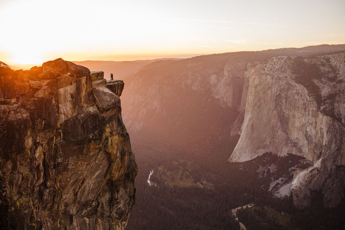 wedding couple stand on cliffs edge in California National Park