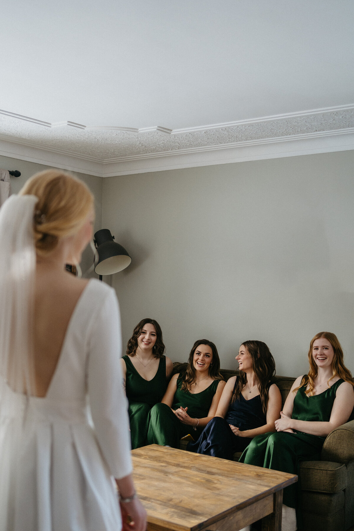 bride standing in front of bridal party