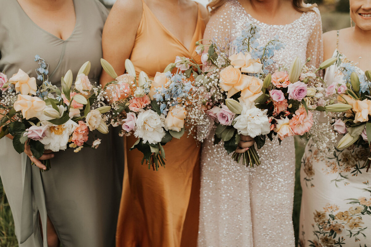 The Vase Floral Co - bridesmaids hold bouquets