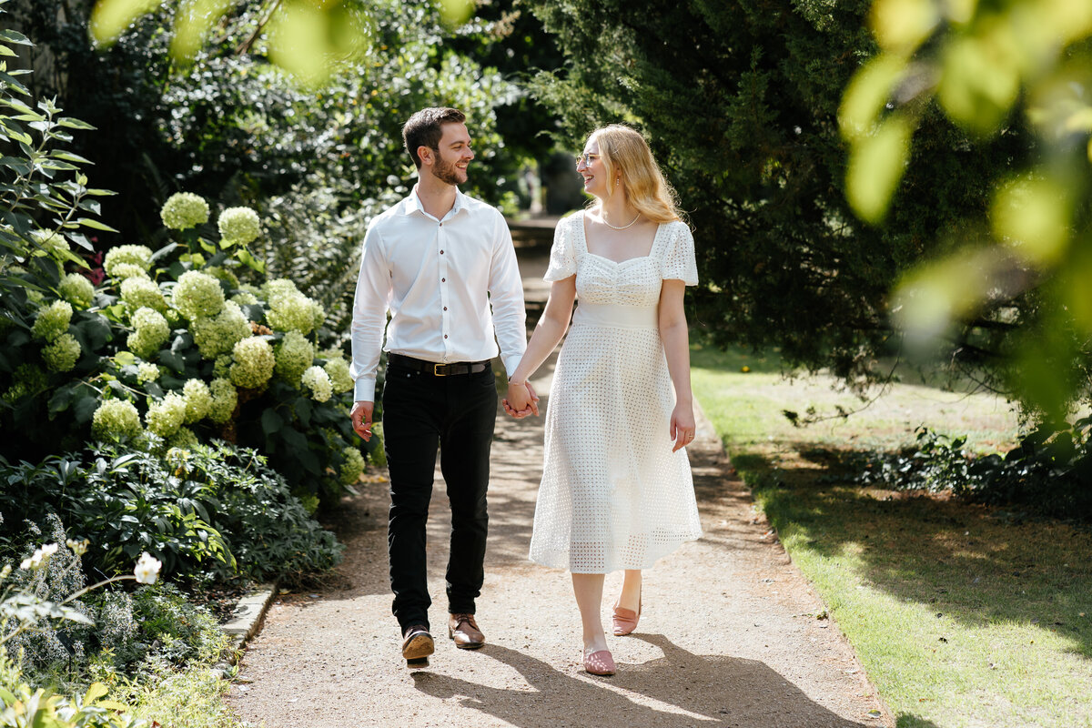Engaged-Couple-Walking-Botanical-Gardens