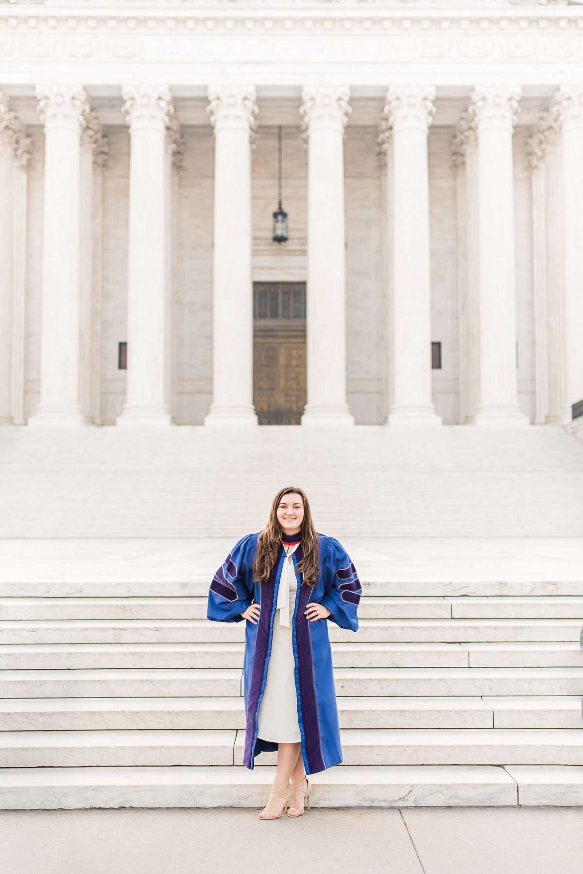 phd law grad standing in front of supreme court