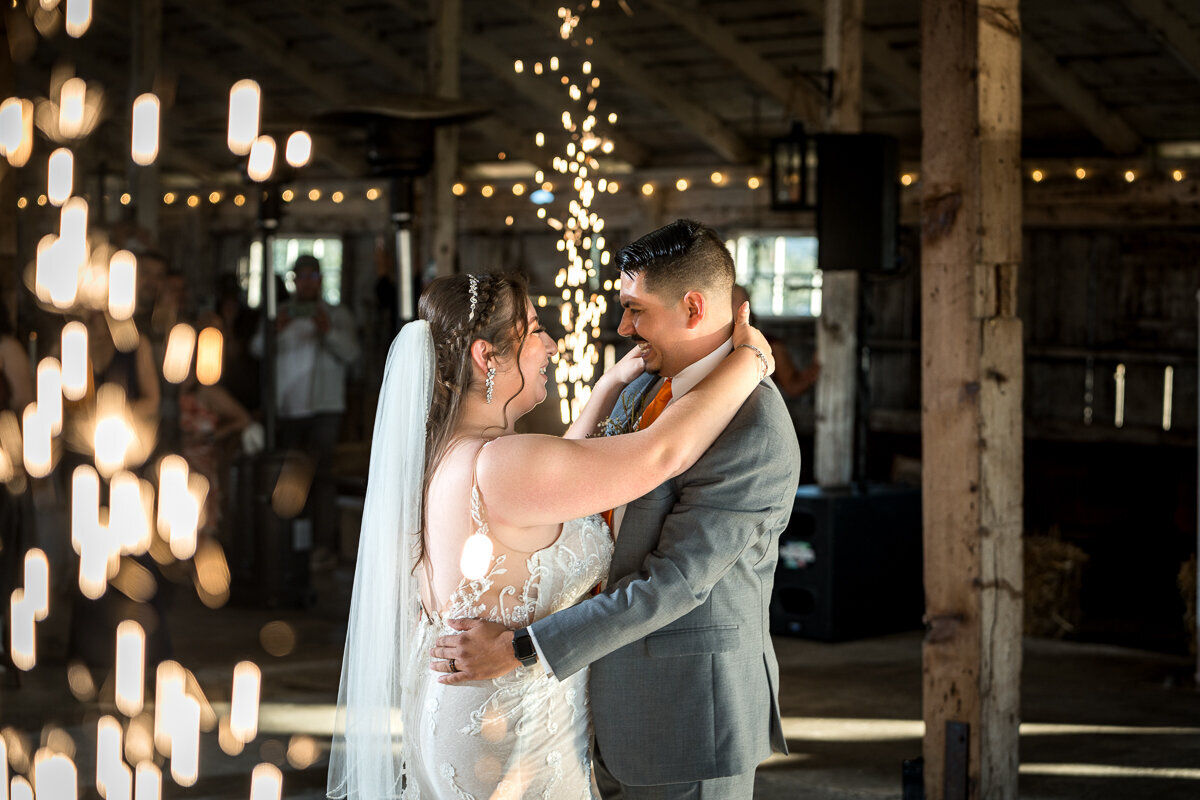 Capturing the unforgettable first dance of the bride and groom at The Barn by Fernbridge in Ferndale, California. With sparks cascading around them on the dance floor, this breathtaking moment highlights the romance and charm of their wedding day in this rustic and elegant venue. Perfect for couples seeking enchanting wedding photography.