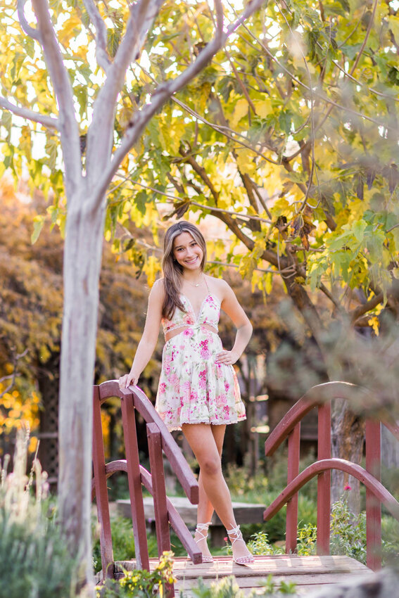 teen girl standing on bridge