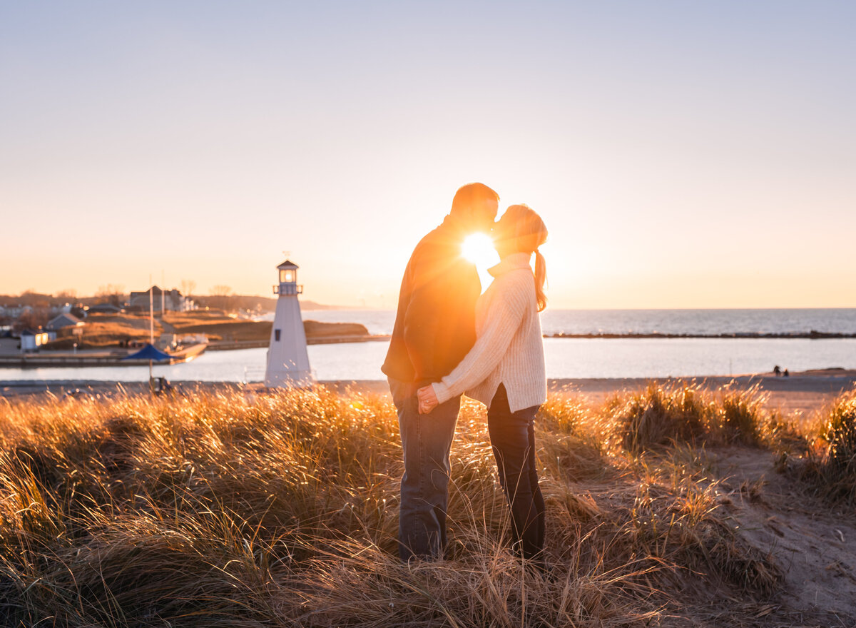 Romantic sunset kiss by the lighthouse, captured with love by Leslie Q Photography