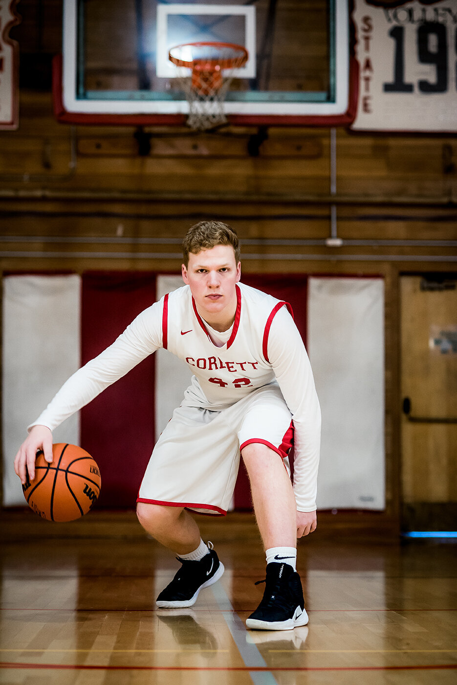 senior boy playing basketball