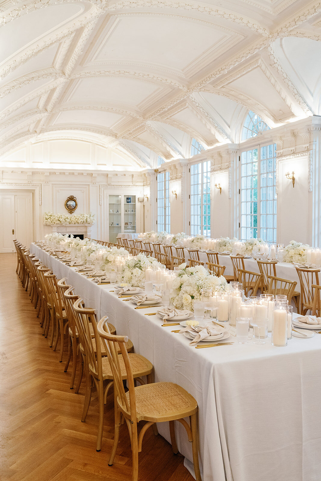 Two long wedding reception table designs with candles.