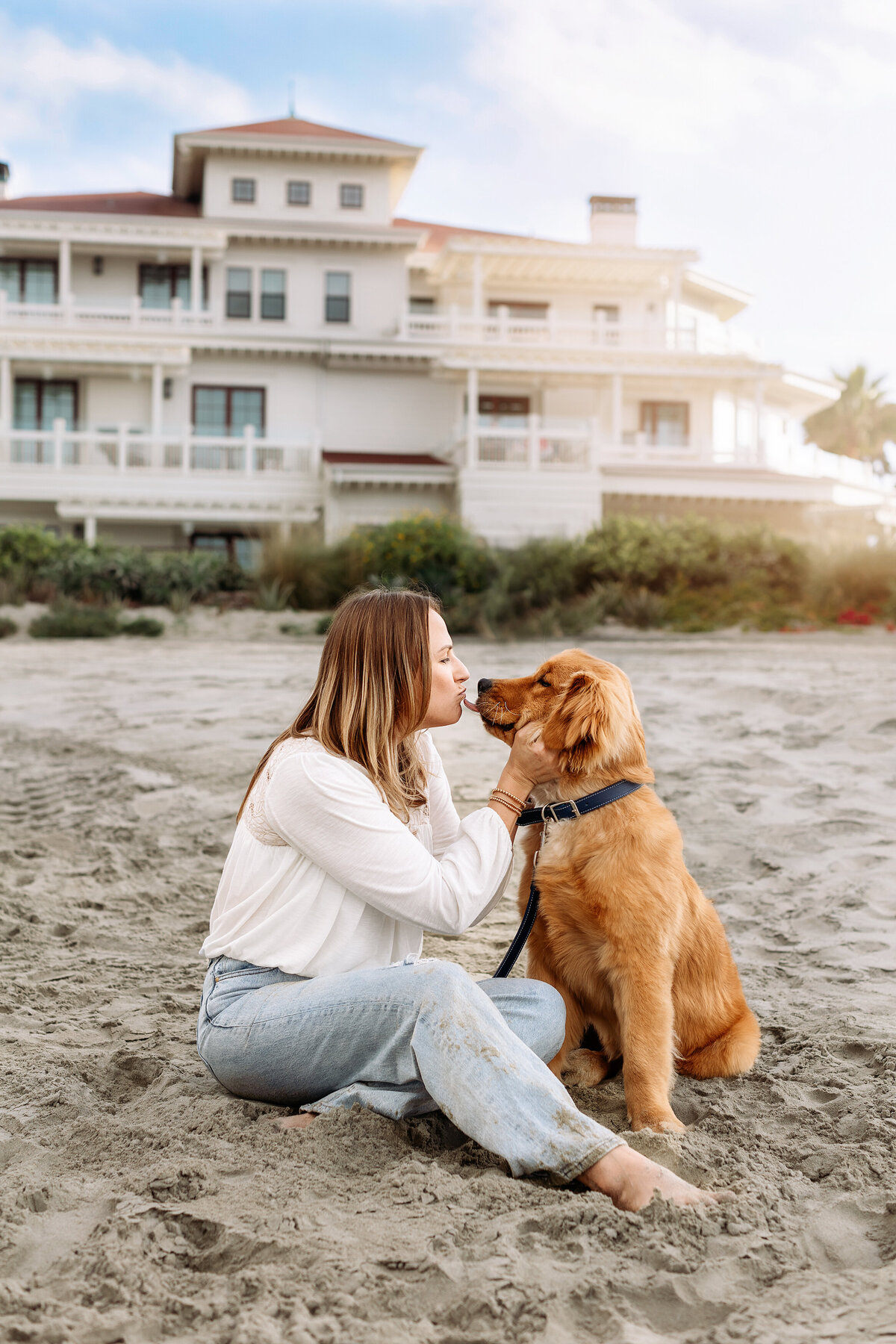 mom kissing new golden puppy in denver during photos