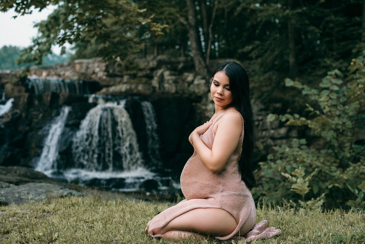forest waterfall pregnant woman in nature with gold sheer dress maternity outdoor photography