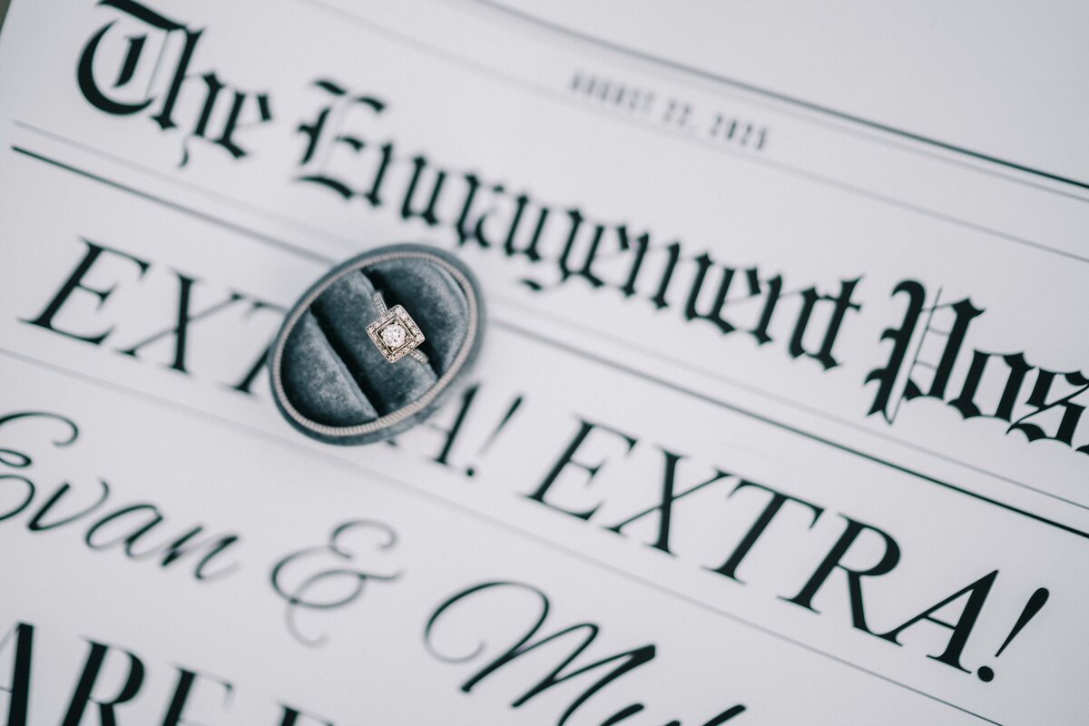 Villa Li Engagement ring and newspaper