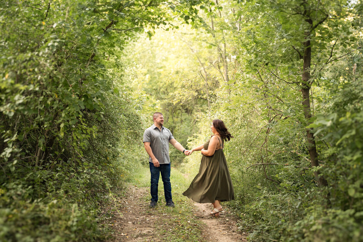 couple dancing in a forest