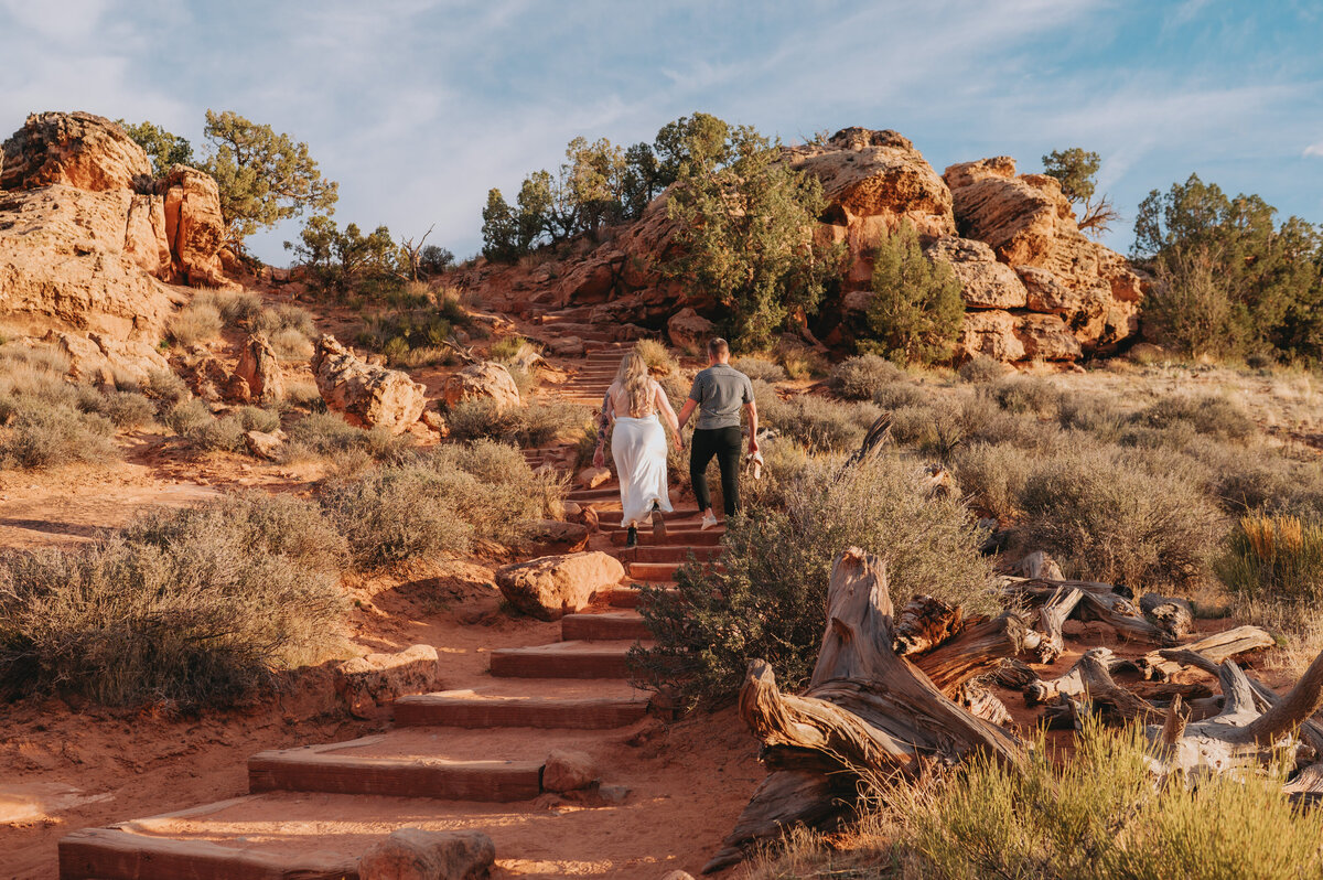 Newlyweds walk up steps
