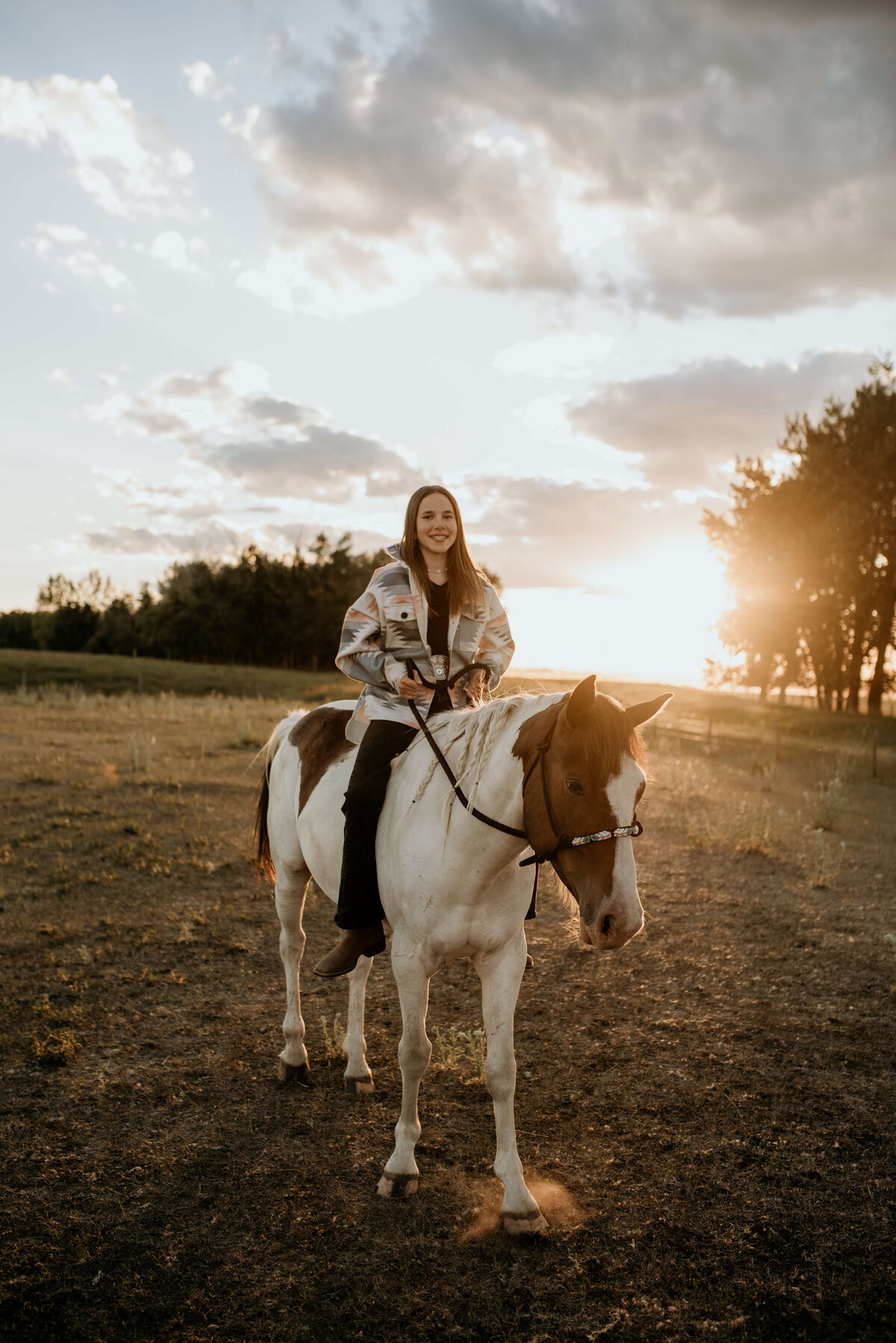 Girl rides white and brown horse