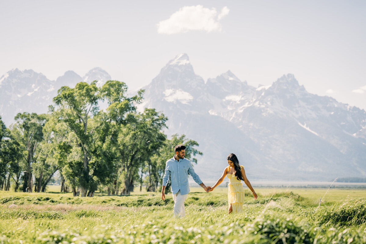 Grand Teton National Park Elopement Mormon Row TA Moulton Barn couple with tall grass and trees