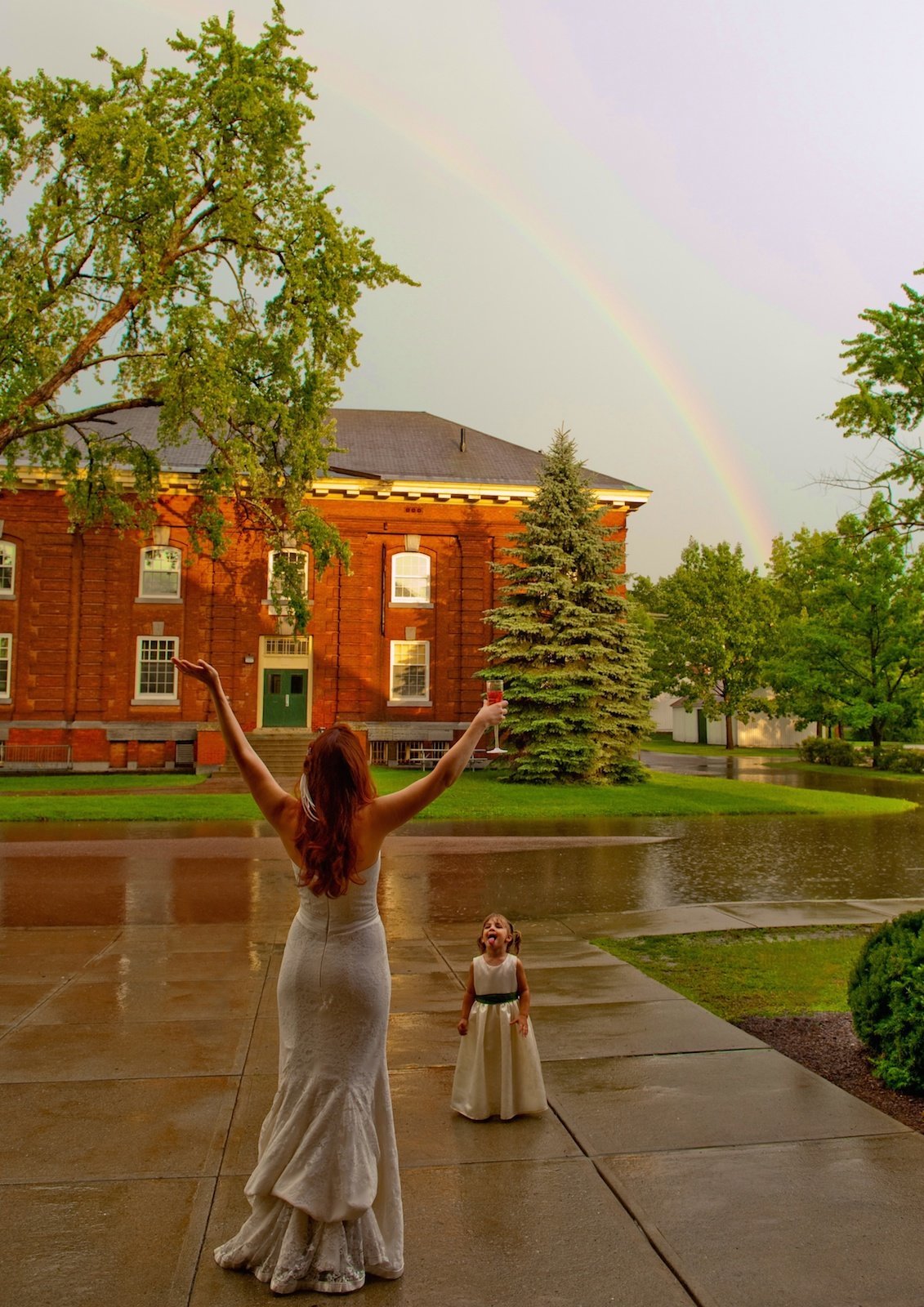 bride reaching for a rainbow